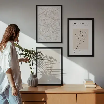 Three-piece wall art set with minimalist botanical motifs