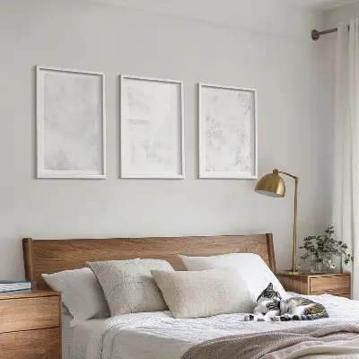 Set of 3 framed wall art pieces with a minimalist white spots background