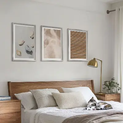 Three-piece wall art set with stones wood and fabric textures