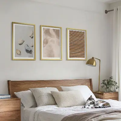 Three-piece wall art set with stones wood and fabric textures