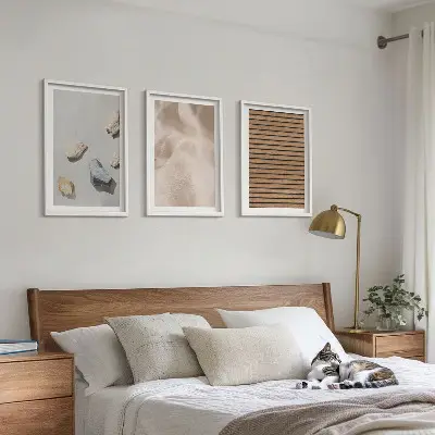 Three-piece wall art set with stones wood and fabric textures