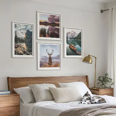 Wall art set featuring a mountain lake boat sunset and deer