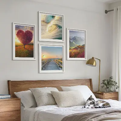 Multi-piece wall art set featuring landscapes of mountains, waves, trees, hearts, and piers