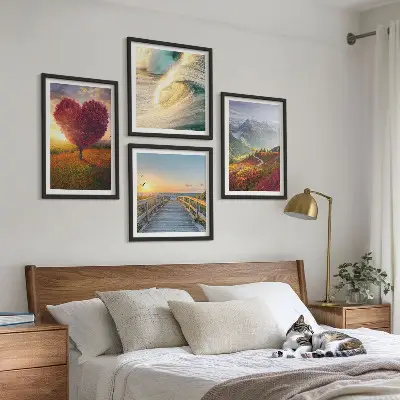 Multi-piece wall art set featuring landscapes of mountains, waves, trees, hearts, and piers