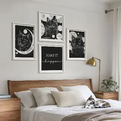 Wall art set featuring black cats, a moon, and a planet