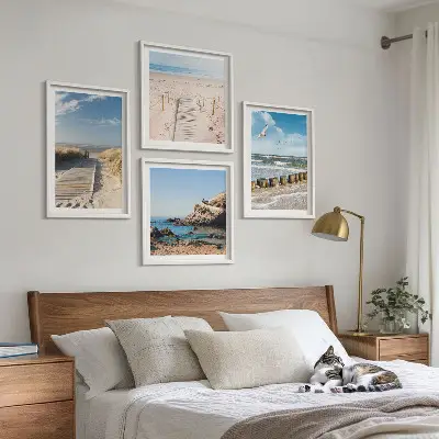 Multi-piece wall decor set featuring a coastal beach scene with sand waves sky and birds