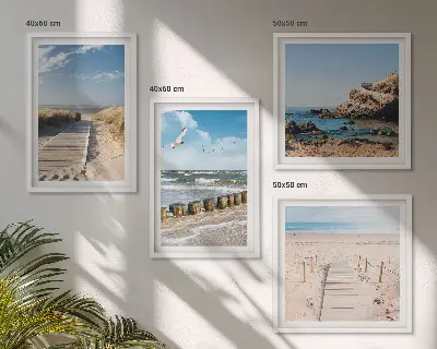 Multi-piece wall decor set featuring a coastal beach scene with sand waves sky and birds