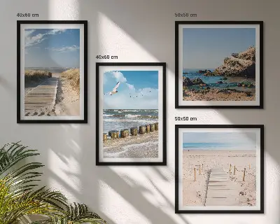 Multi-piece wall decor set featuring a coastal beach scene with sand waves sky and birds