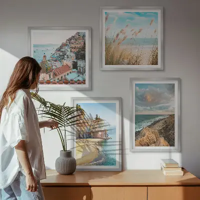 Set of 4 wall art pieces featuring landscape scenes of beaches, cities, and cliffs