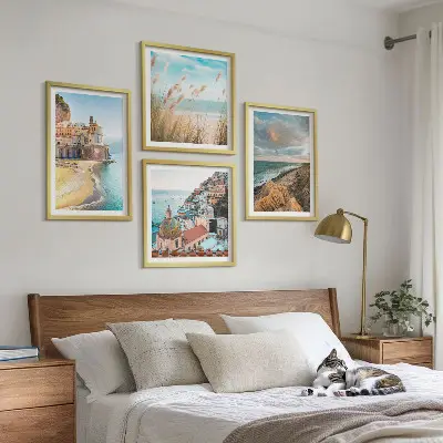 Set of 4 wall art pieces featuring landscape scenes of beaches, cities, and cliffs