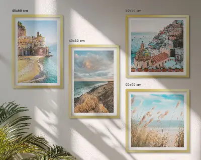 Set of 4 wall art pieces featuring landscape scenes of beaches, cities, and cliffs