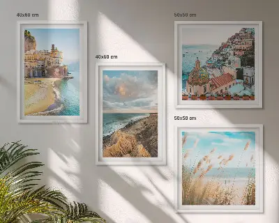 Set of 4 wall art pieces featuring landscape scenes of beaches, cities, and cliffs