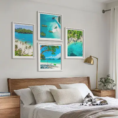 Set of four beach themed wall art pieces featuring palm trees and crystal water