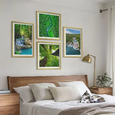 Multi-piece wall decor set featuring a green forest and waterfall landscape
