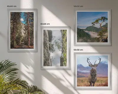 Set of 4 wall art pieces featuring a road forest mountains and deer nature theme