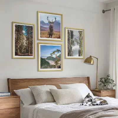Set of 4 wall art pieces featuring a road forest mountains and deer nature theme