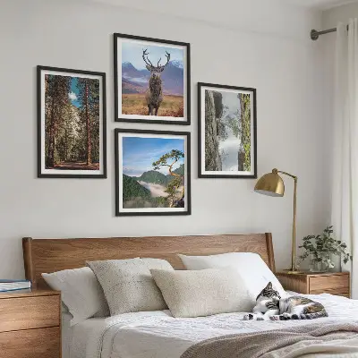 Set of 4 wall art pieces featuring a road forest mountains and deer nature theme
