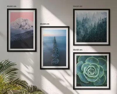 Wall art set mountains with a pink sky over succulent plants and water
