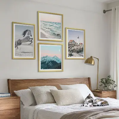 Set of 4 wall art pieces featuring horses in motion on a beach with a lighthouse and mountain landscape