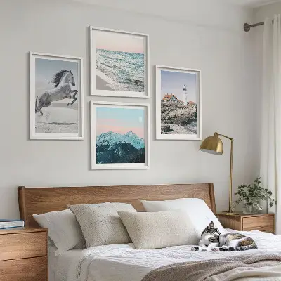 Set of 4 wall art pieces featuring horses in motion on a beach with a lighthouse and mountain landscape