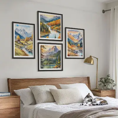 Set of 4 wall art pieces featuring a mountain landscape with a river and cottages