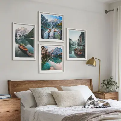 Wall art set featuring a lake, mountains, boats, and a cottage