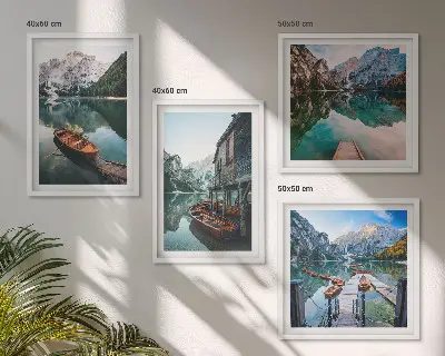 Wall art set featuring a lake, mountains, boats, and a cottage
