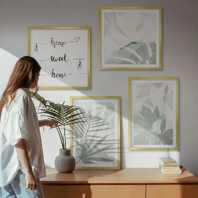 Wall art set with a greenish-gray plant leaves design