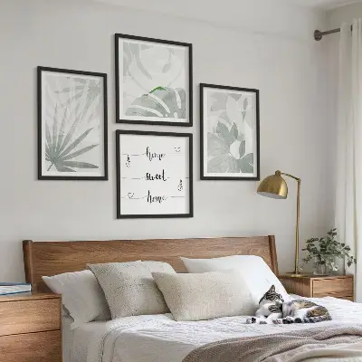 Wall art set with a greenish-gray plant leaves design