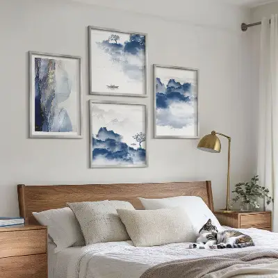 Multi-piece wall decor set featuring a mountain landscape with clouds trees and birds