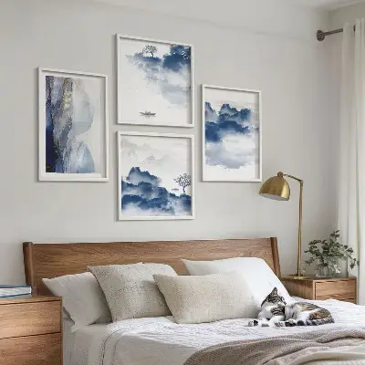 Multi-piece wall decor set featuring a mountain landscape with clouds trees and birds