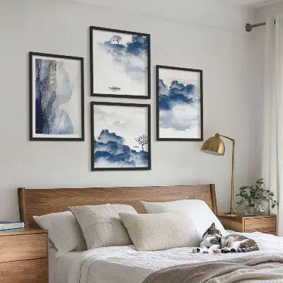 Multi-piece wall decor set featuring a mountain landscape with clouds trees and birds