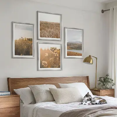 Set of 4 wall art pieces featuring landscape scenes of meadows mountains and a lake