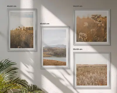 Set of 4 wall art pieces featuring landscape scenes of meadows mountains and a lake