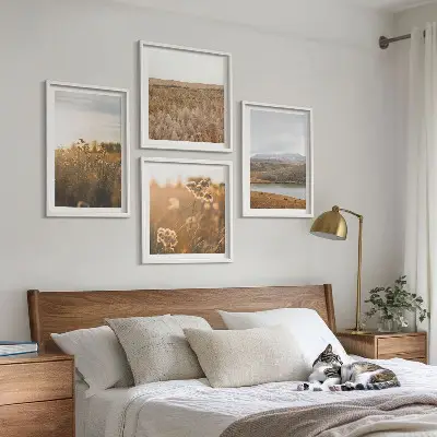 Set of 4 wall art pieces featuring landscape scenes of meadows mountains and a lake