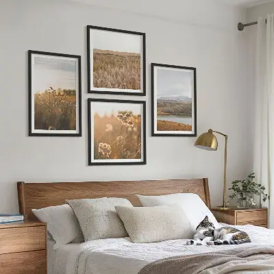 Set of 4 wall art pieces featuring landscape scenes of meadows mountains and a lake