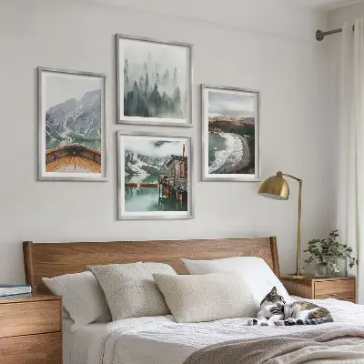 Set of 4 wall art pieces featuring mountains, a lake, a boat, fog, and a beach