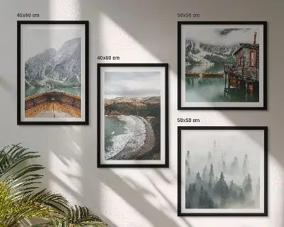 Set of 4 wall art pieces featuring mountains, a lake, a boat, fog, and a beach