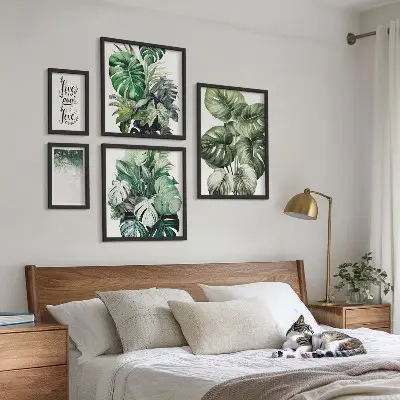 Gallery wall featuring plant motifs, quotes, and abstract art
