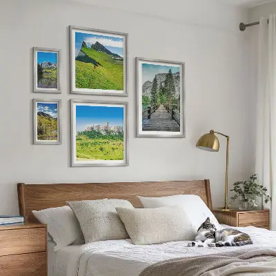 Gallery wall featuring mountain landscapes and waterfalls