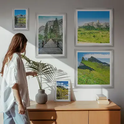 Gallery wall featuring mountain landscapes and waterfalls