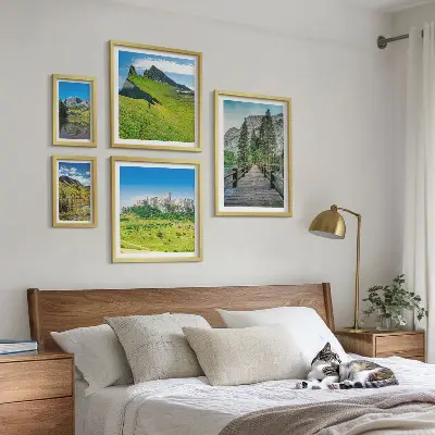 Gallery wall featuring mountain landscapes and waterfalls