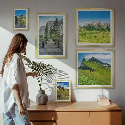 Gallery wall featuring mountain landscapes and waterfalls