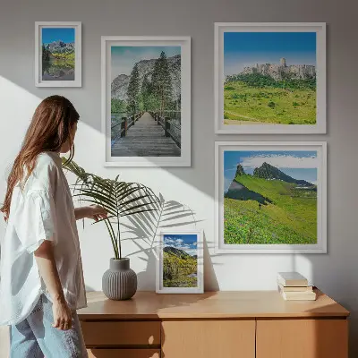 Gallery wall featuring mountain landscapes and waterfalls