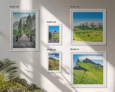 Gallery wall featuring mountain landscapes and waterfalls