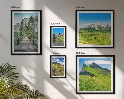 Gallery wall featuring mountain landscapes and waterfalls