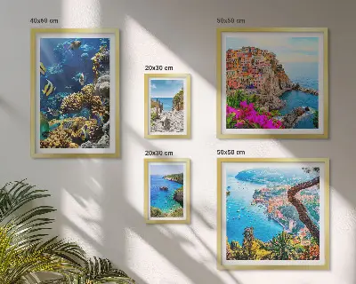 Gallery wall featuring seaside landscapes, fish, and beaches