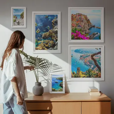 Gallery wall featuring seaside landscapes, fish, and beaches