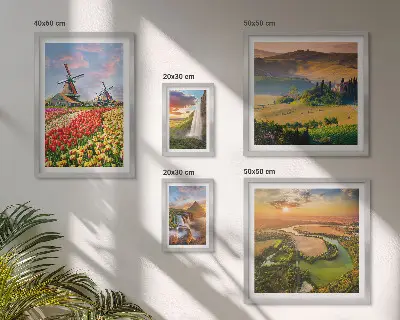 Gallery wall featuring landscapes of nature with waterfalls and windmills