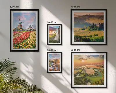 Gallery wall featuring landscapes of nature with waterfalls and windmills